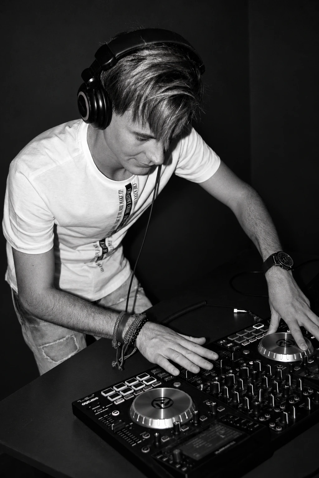 Editorial black-and-white edit of DJ NINE SA at the decks
